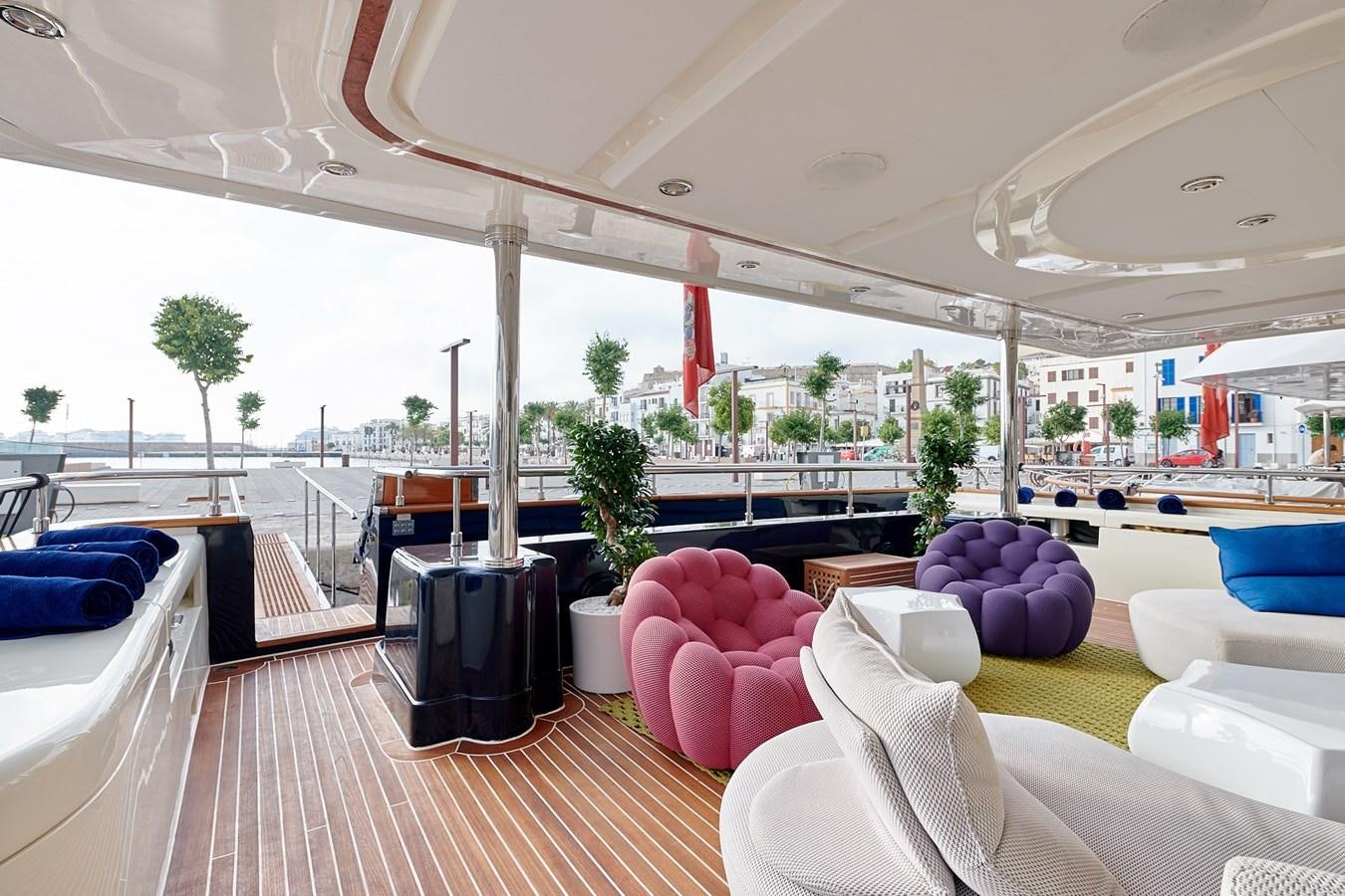 a room with a table chairs and a large window aboard BUNKER Yacht for Sale