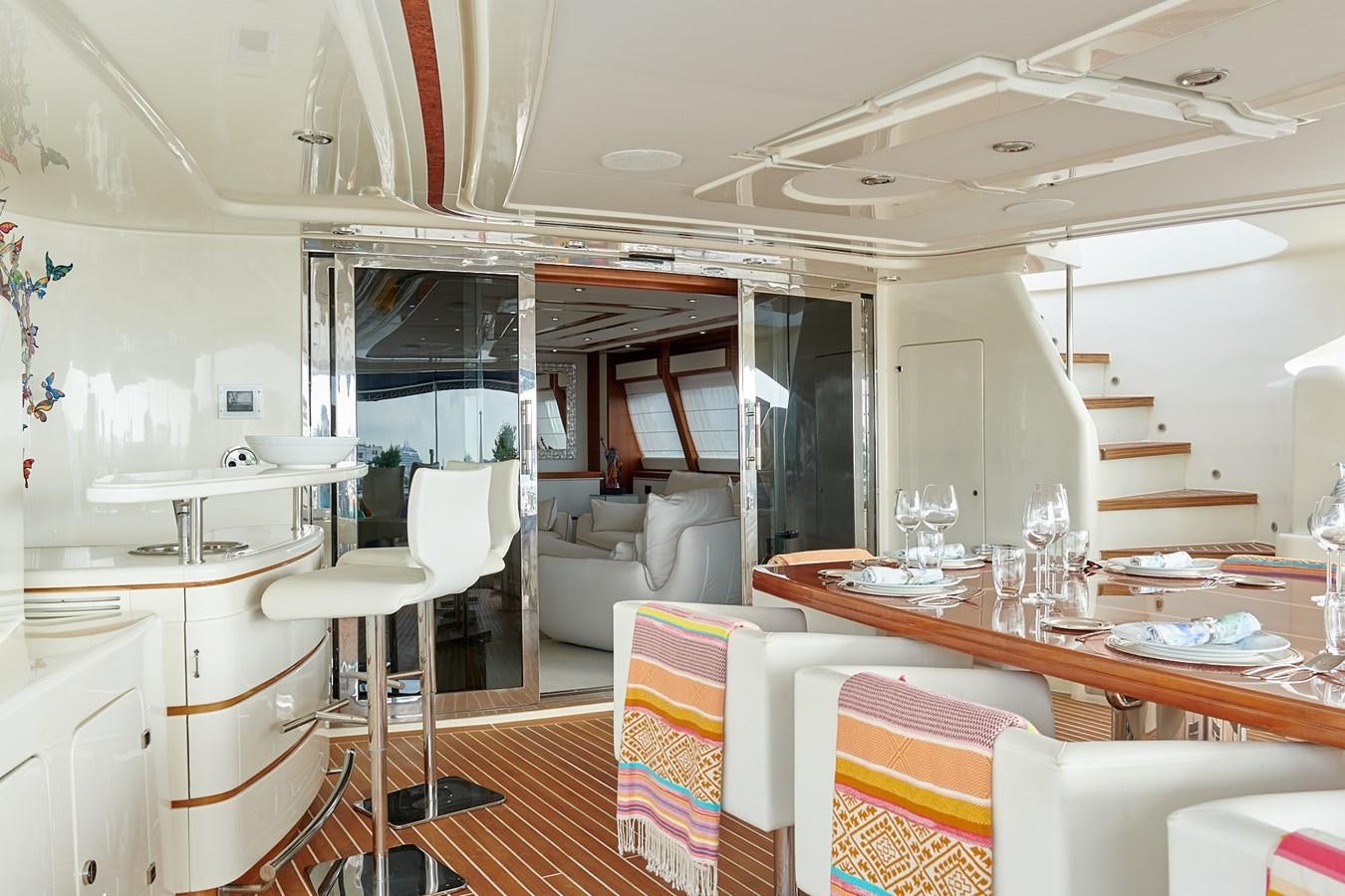 a dining room with a table and chairs aboard BUNKER Yacht for Sale