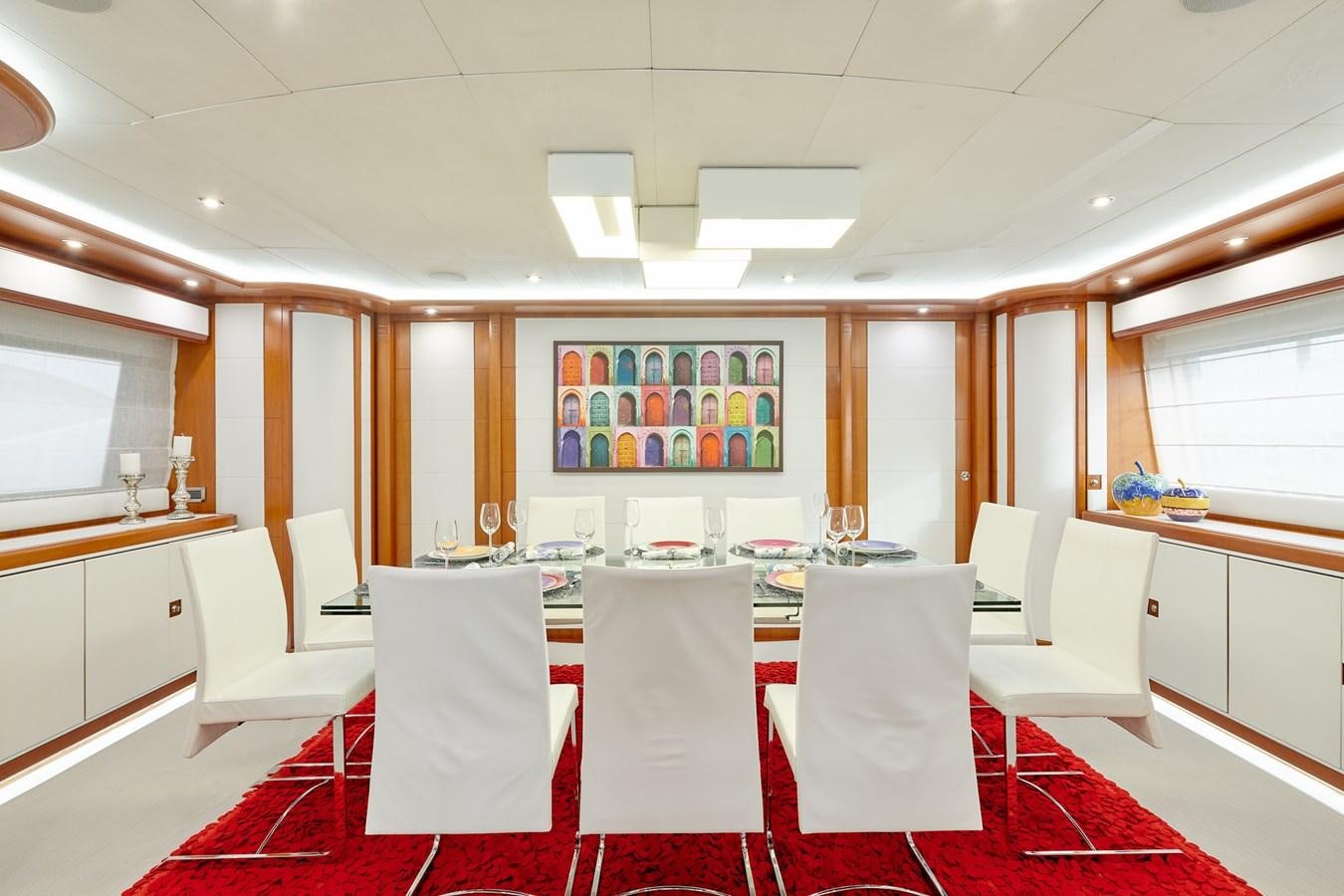 a room with tables and chairs aboard BUNKER Yacht for Sale