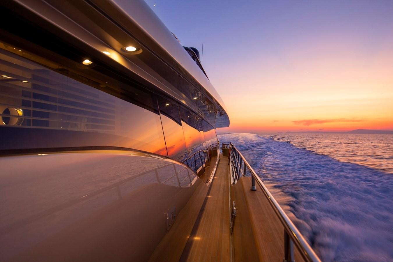 the wing of a plane above the clouds aboard CANADOS 122’ CAESAR RPH Yacht for Sale