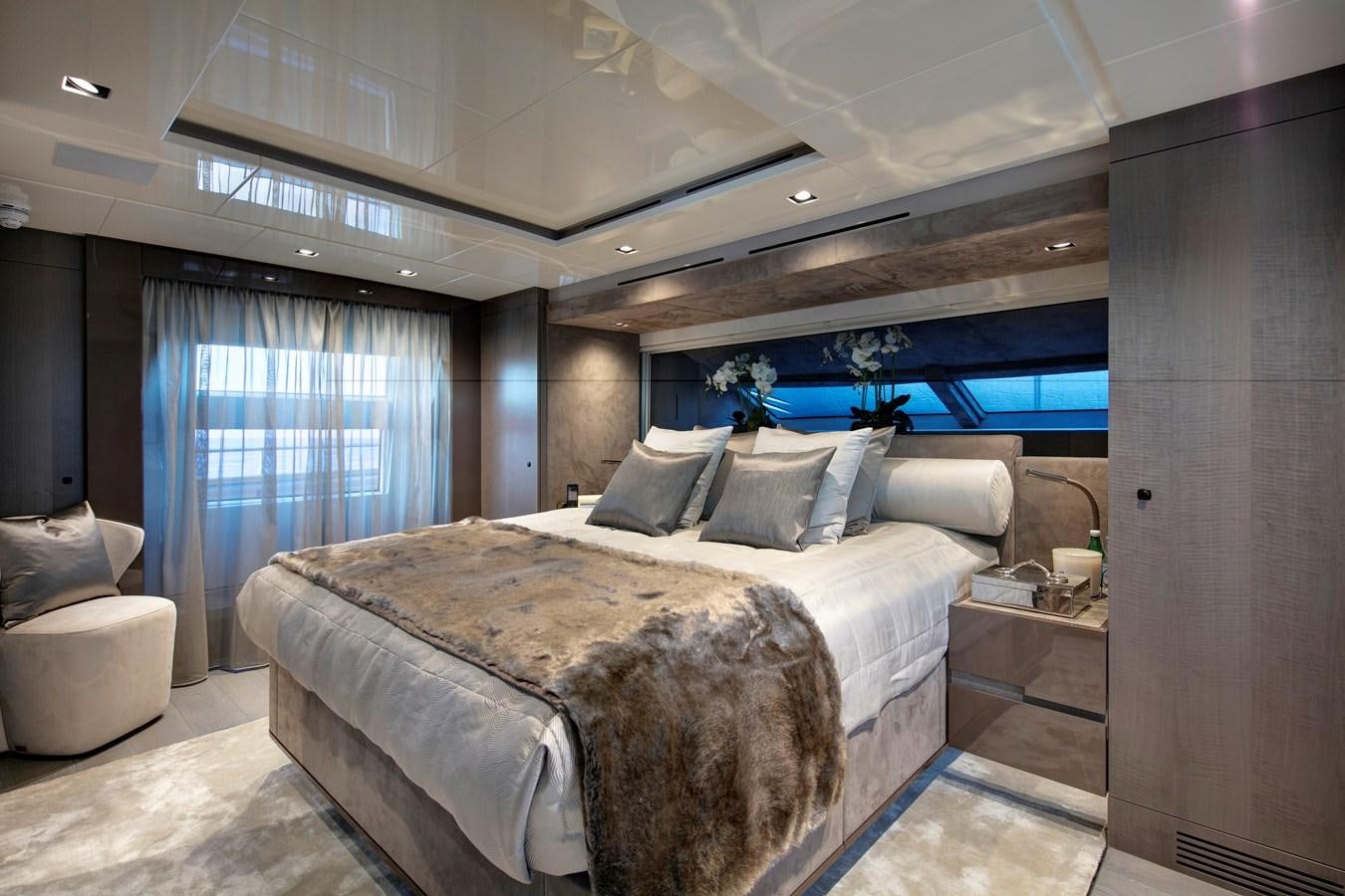 a bed in a room aboard CANADOS 122’ CAESAR RPH Yacht for Sale