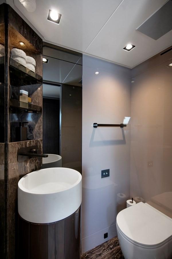 a bathroom with a sink and toilet aboard CANADOS 122’ CAESAR RPH Yacht for Sale