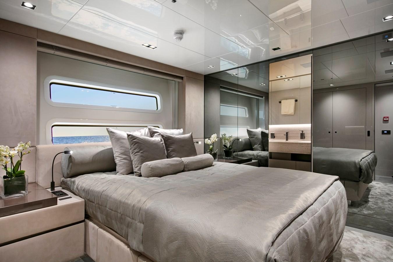 a bed in a room aboard CANADOS 122’ CAESAR RPH Yacht for Sale