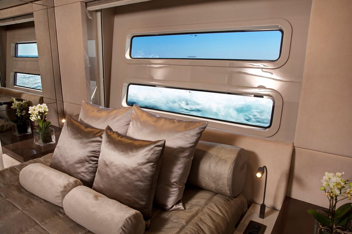 a couch with a television on aboard CANADOS 122’ CAESAR RPH Yacht for Sale