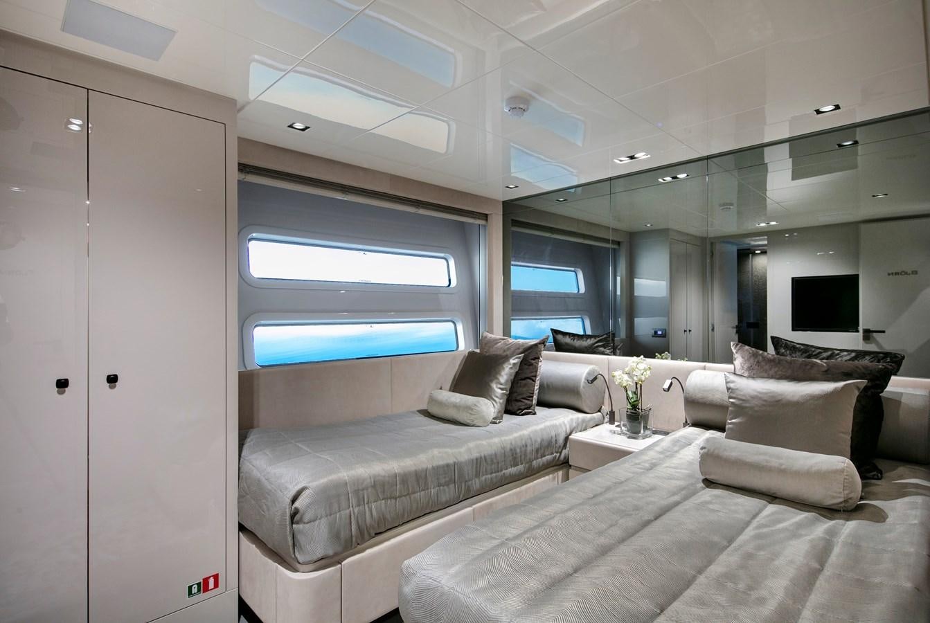 a room with a bed and a window aboard CANADOS 122’ CAESAR RPH Yacht for Sale
