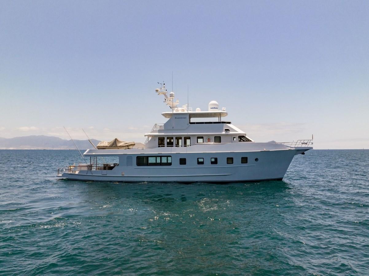 a large white boat in the water aboard HARDHOME Yacht for Sale