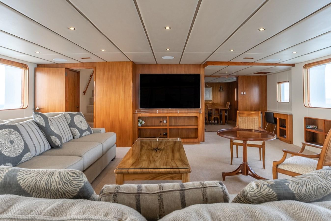 a living room with a couch and a television aboard HARDHOME Yacht for Sale