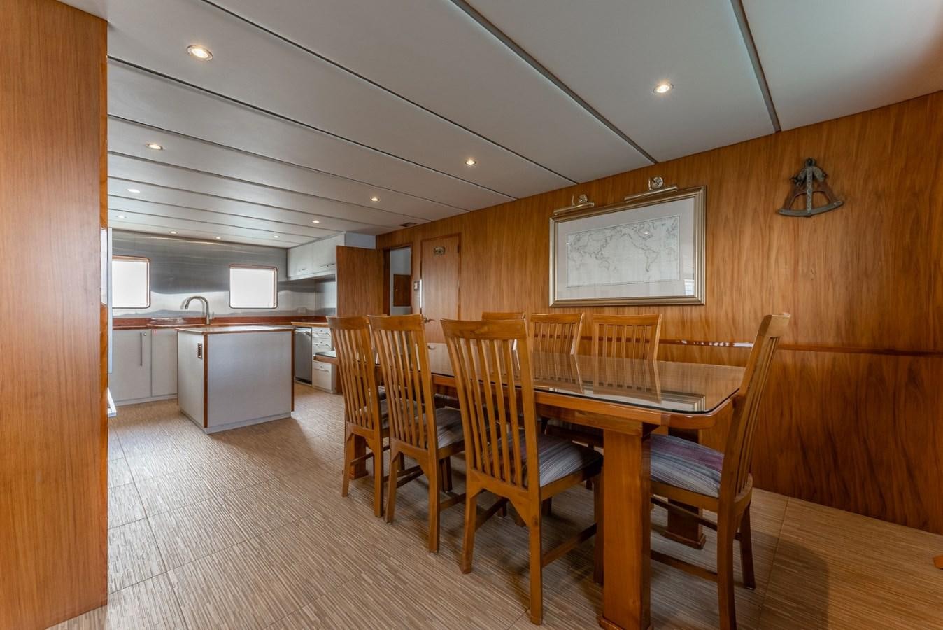 a large kitchen and dining room area aboard HARDHOME Yacht for Sale