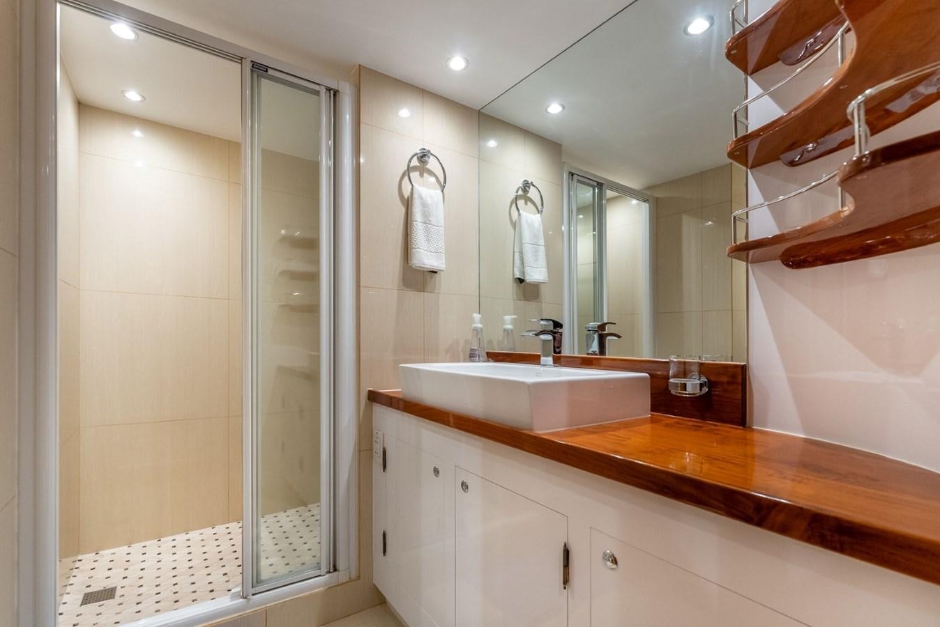 a bathroom with a large mirror aboard HARDHOME Yacht for Sale
