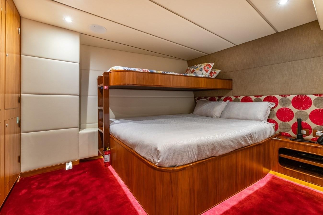 a bed in a room aboard HARDHOME Yacht for Sale