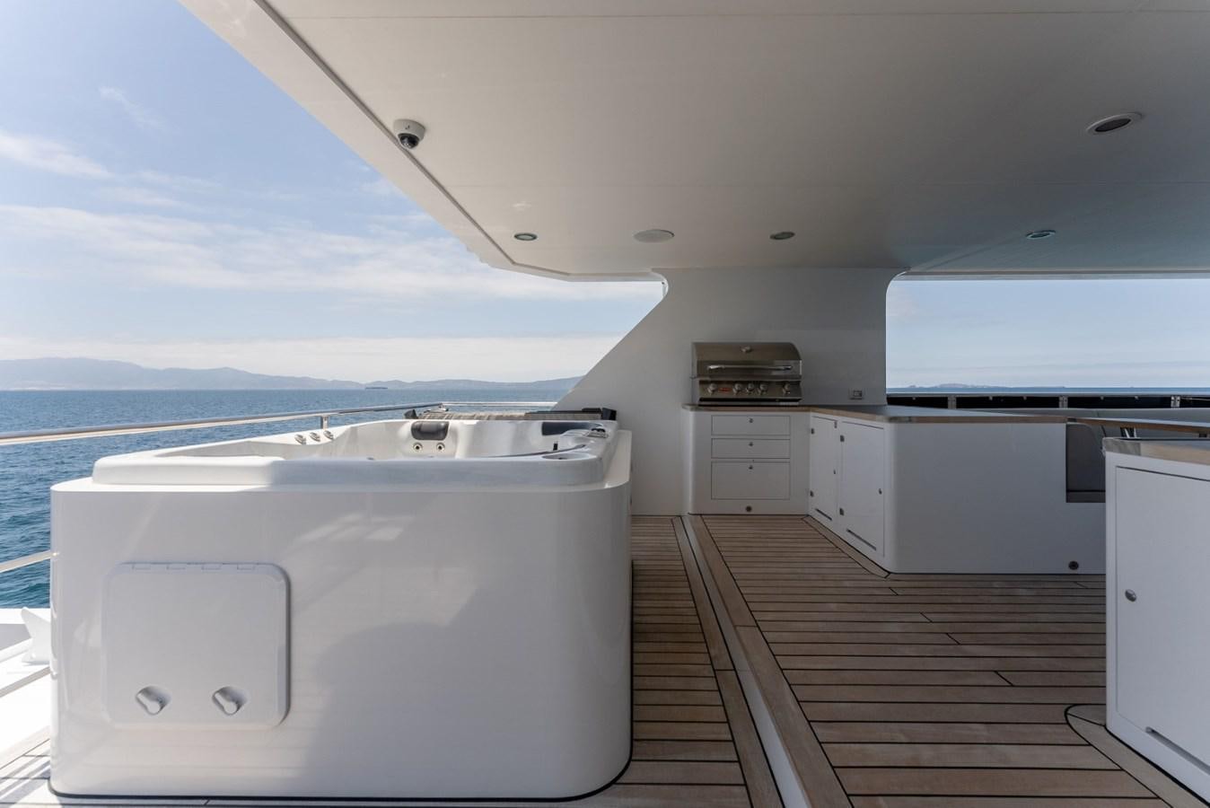 a large white boat in a large white room aboard HARDHOME Yacht for Sale