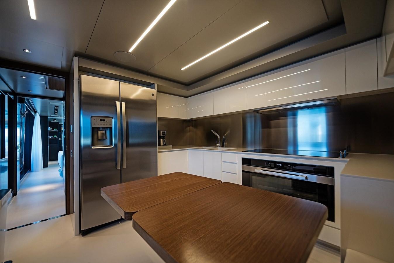 a kitchen with a large island aboard ALLEGRA Yacht for Sale