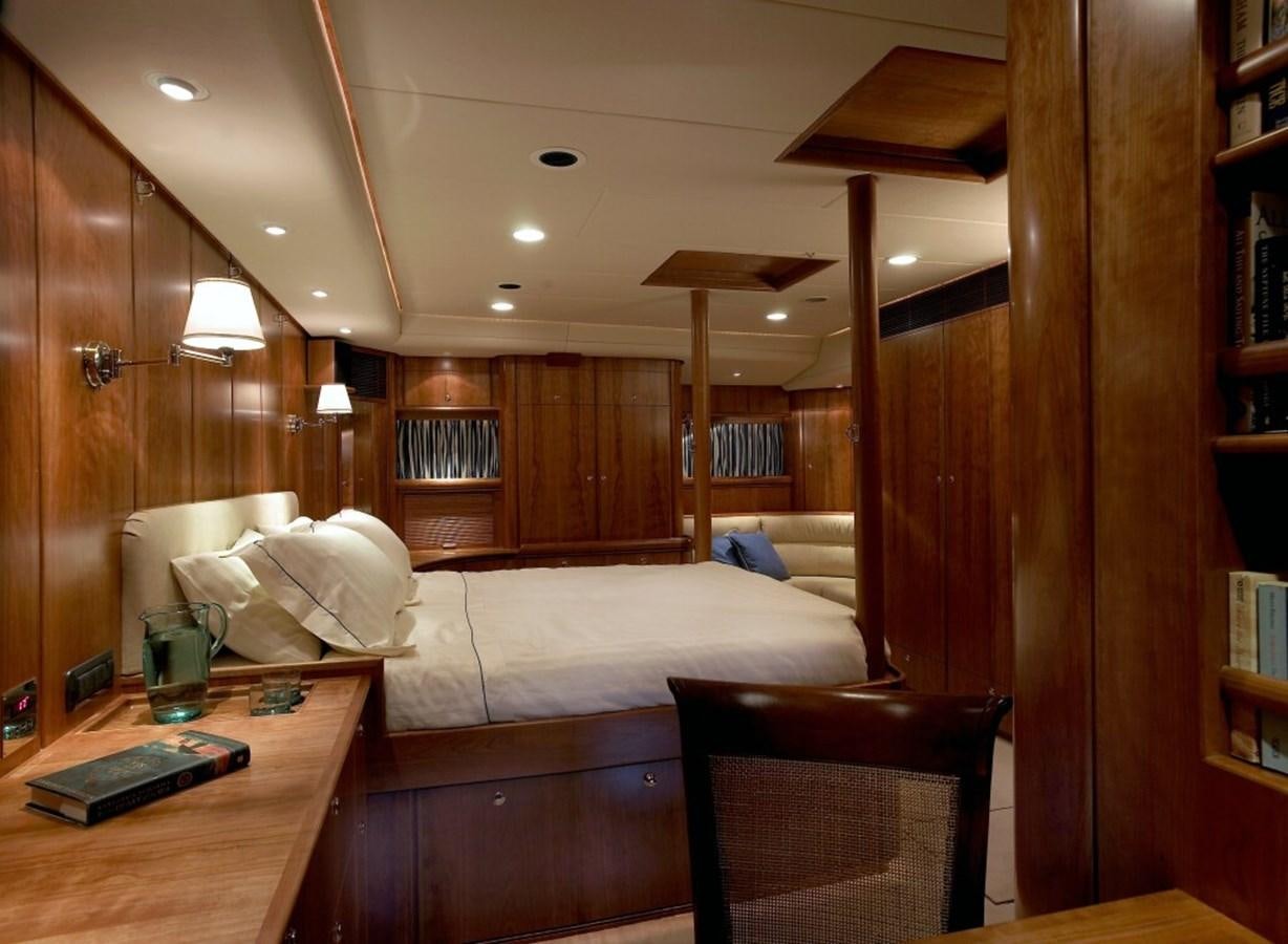 a room with a bed and a desk aboard SULTANA Yacht for Sale
