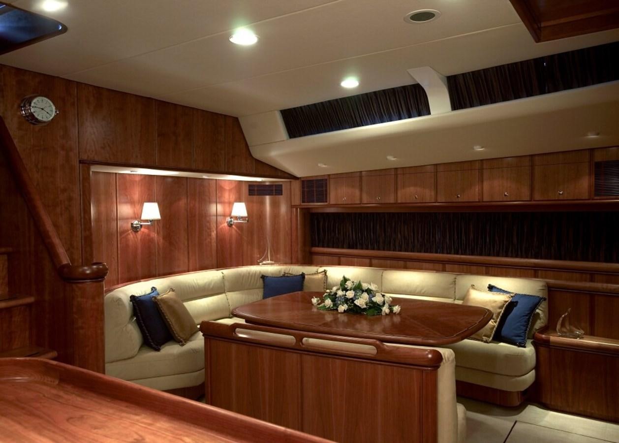 a room with a couch and a table aboard SULTANA Yacht for Sale