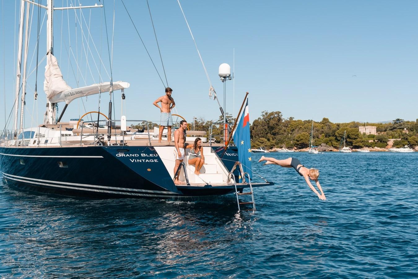 a group of people on a boat aboard GRAND BLEU VINTAGE Yacht for Sale