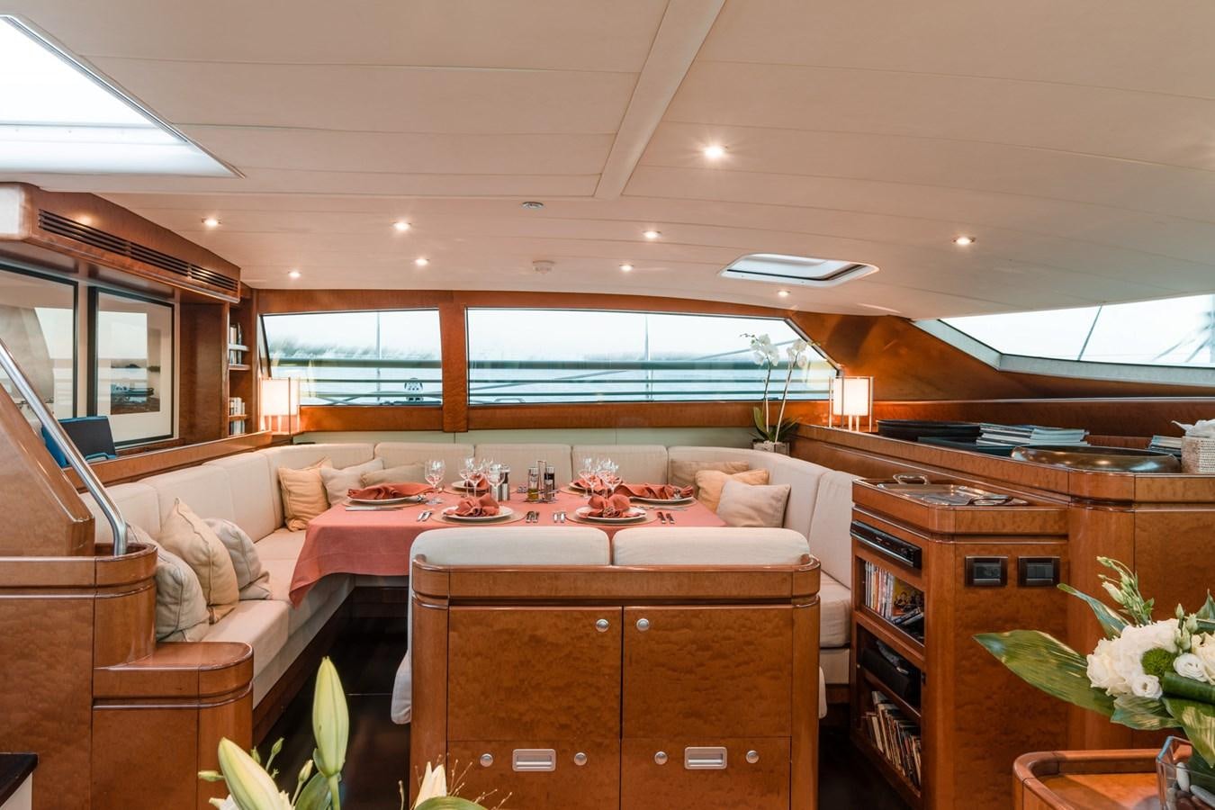 a living room with a couch and a table aboard GRAND BLEU VINTAGE Yacht for Sale