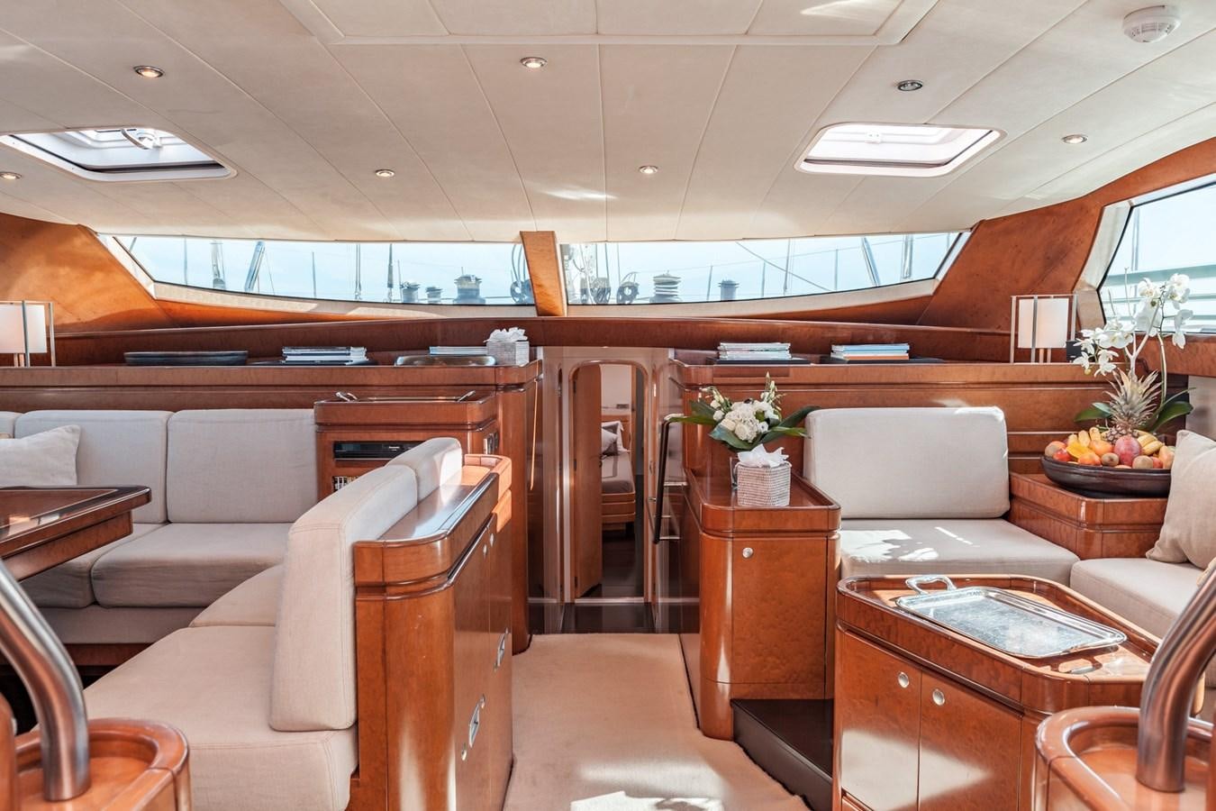 a room with couches and chairs aboard GRAND BLEU VINTAGE Yacht for Sale