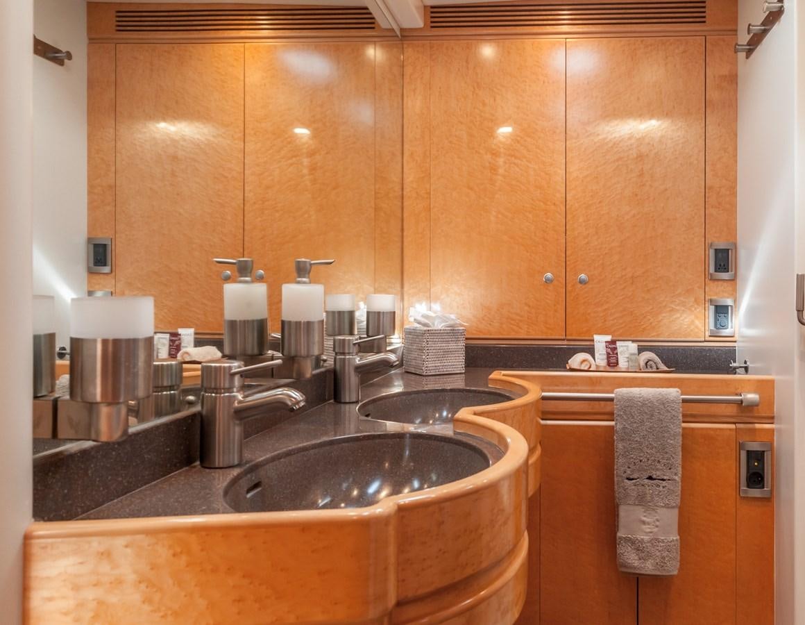 a kitchen with wooden cabinets aboard GRAND BLEU VINTAGE Yacht for Sale