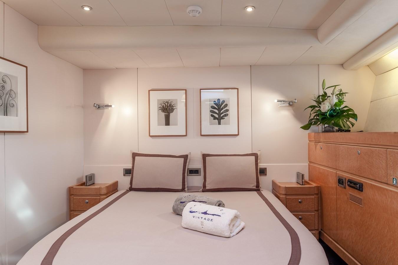 a room with a table and chairs aboard GRAND BLEU VINTAGE Yacht for Sale