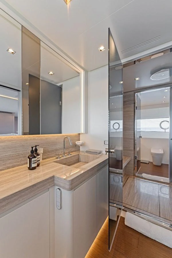 a bathroom with a sink and a mirror aboard LADY K Yacht for Sale