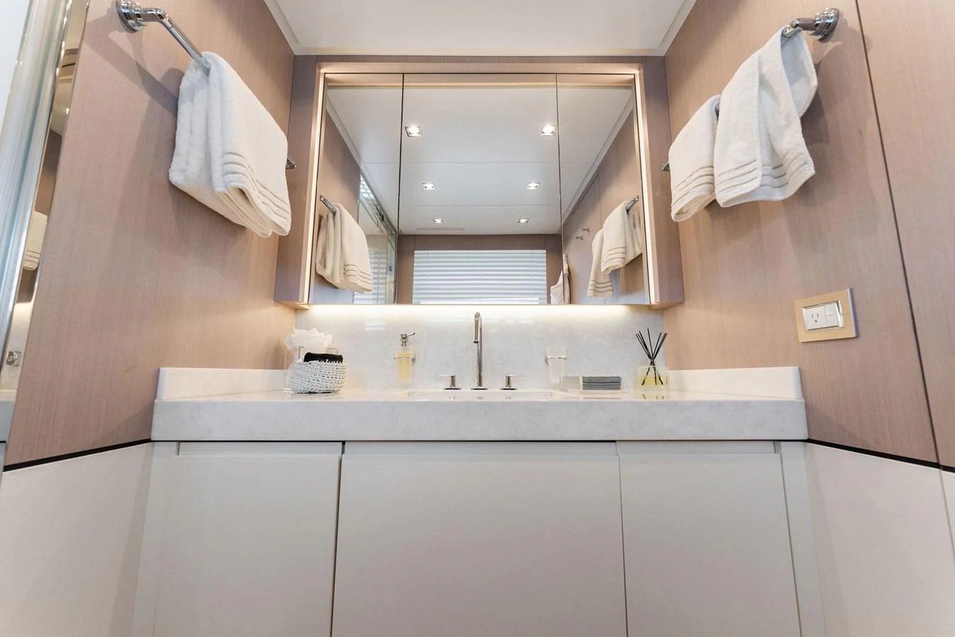 a bathroom with a large mirror aboard LADY K Yacht for Sale