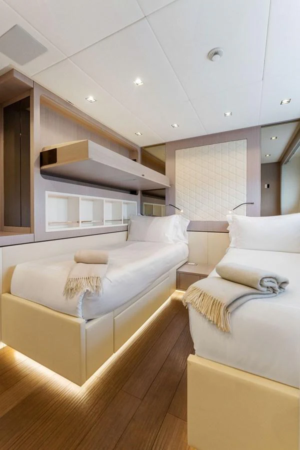 a room with two beds aboard LADY K Yacht for Sale