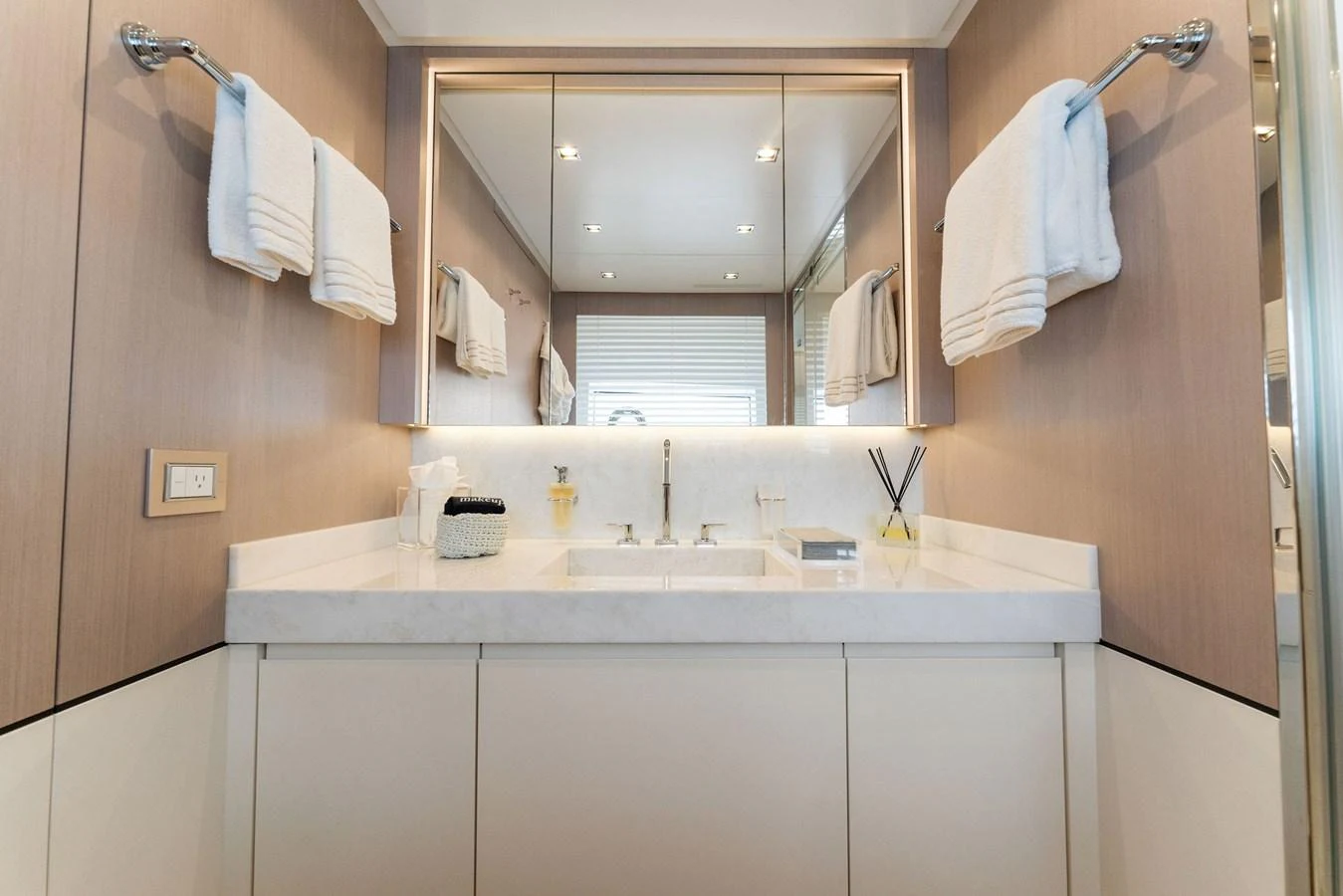 a bathroom with a mirror and a sink aboard LADY K Yacht for Sale
