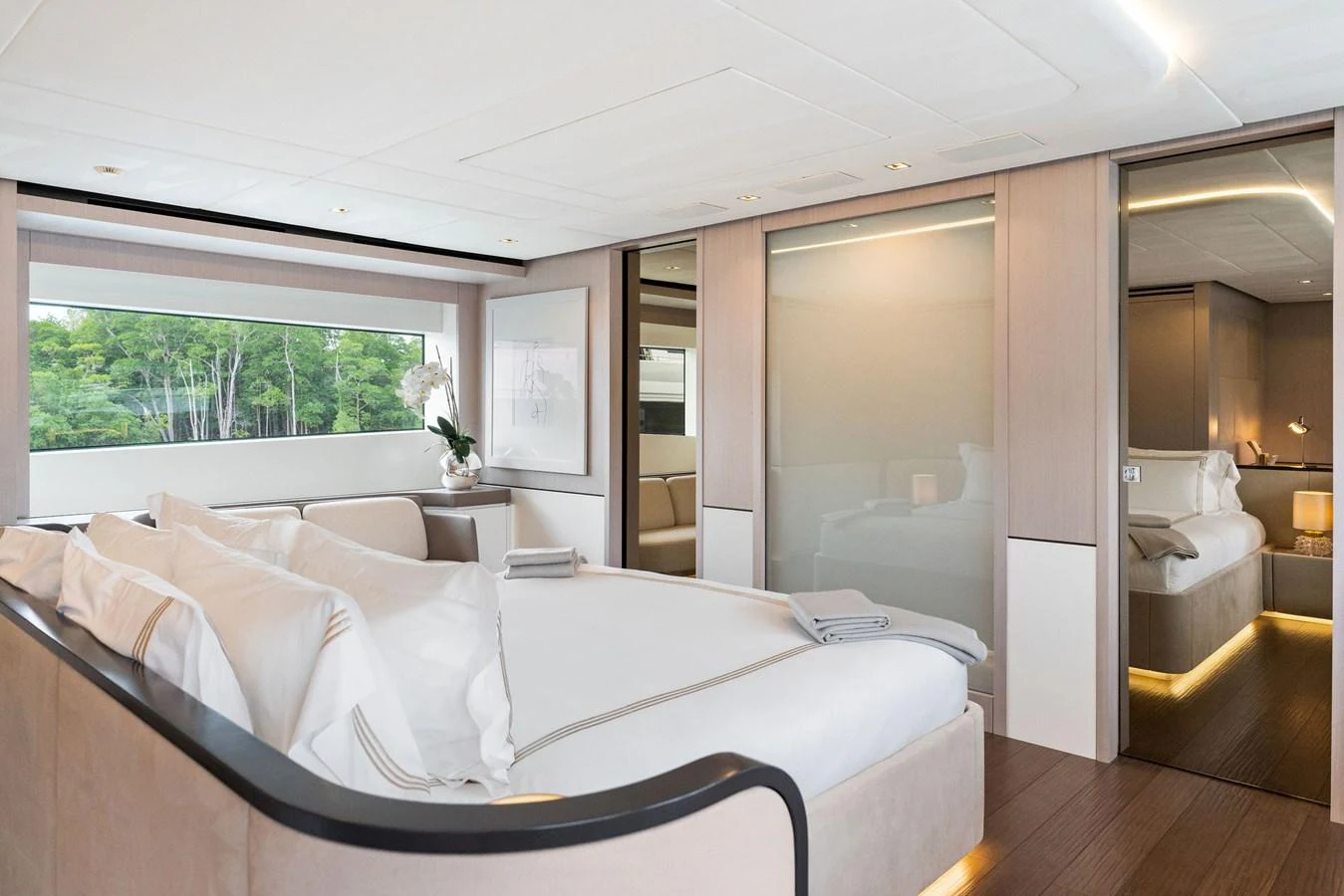 a room with a bed and a window aboard LADY K Yacht for Sale