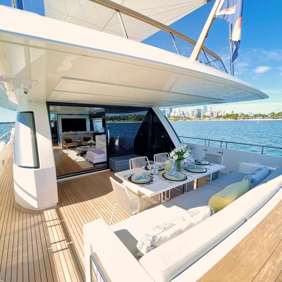a room with a table and chairs aboard C-DAZE Yacht for Sale