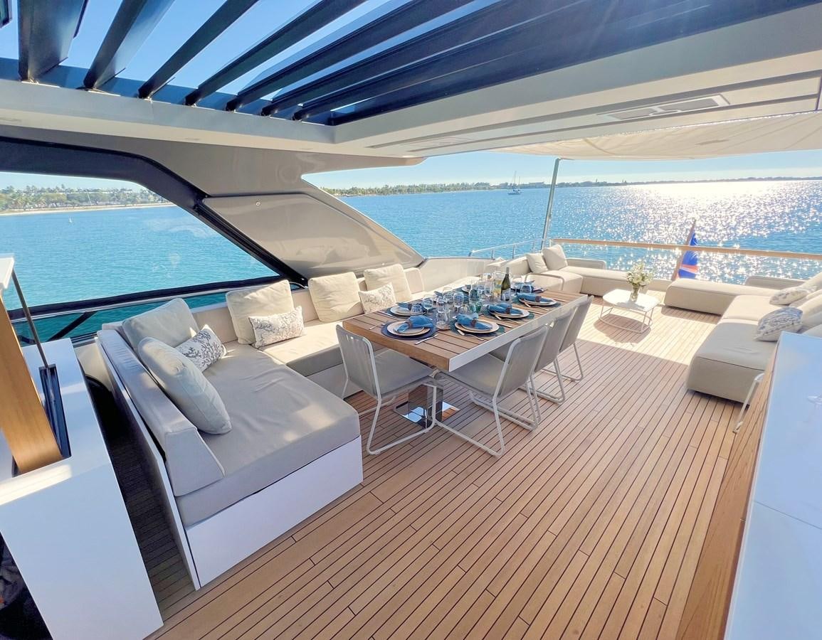 a room with a table chairs and a large body of water aboard C-DAZE Yacht for Sale
