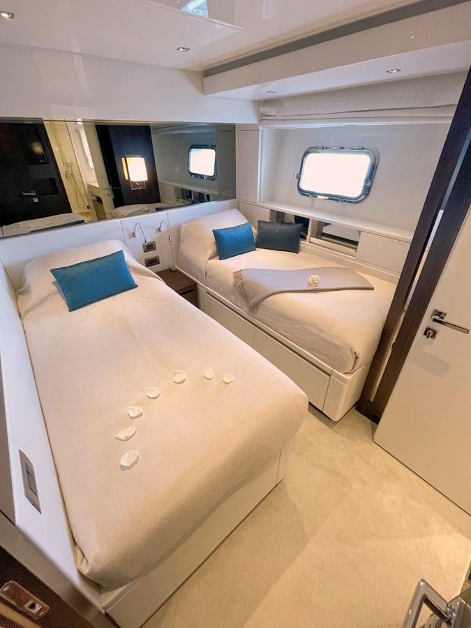 a room with a bed and a window aboard C-DAZE Yacht for Sale