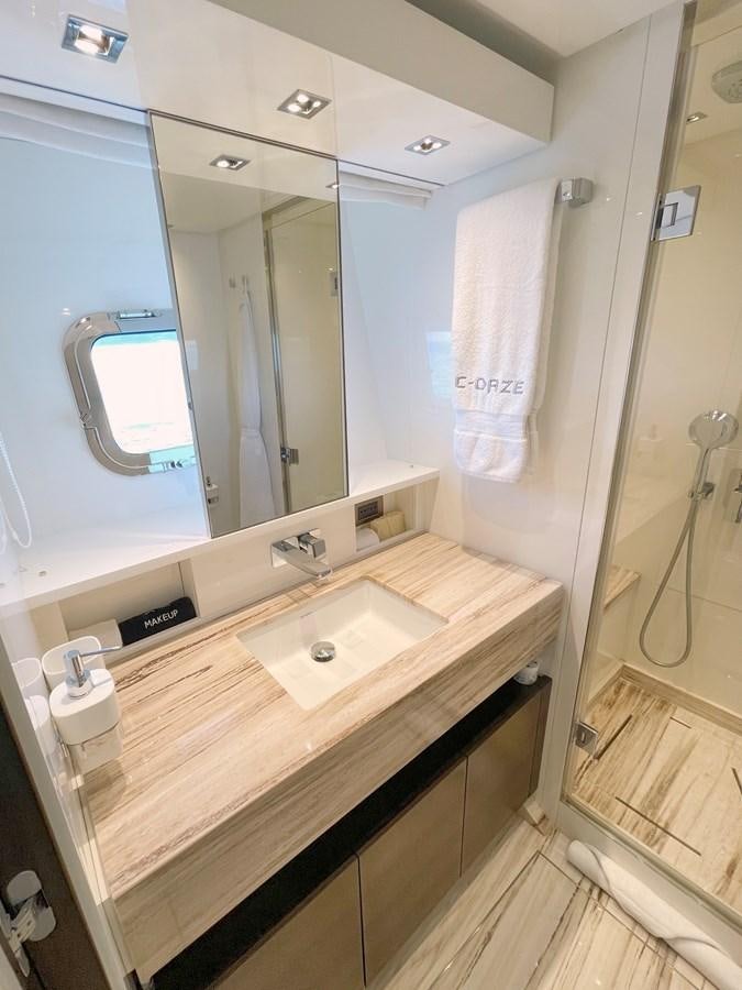 a bathroom with a sink and a mirror aboard C-DAZE Yacht for Sale