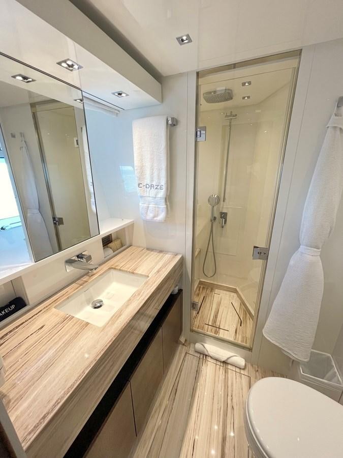 a bathroom with a shower and sink aboard C-DAZE Yacht for Sale