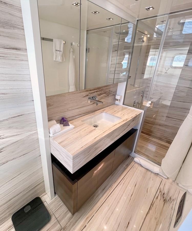 a bathroom with a sink and a mirror aboard C-DAZE Yacht for Sale