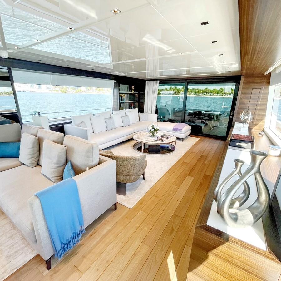 a living room with a large window aboard C-DAZE Yacht for Sale