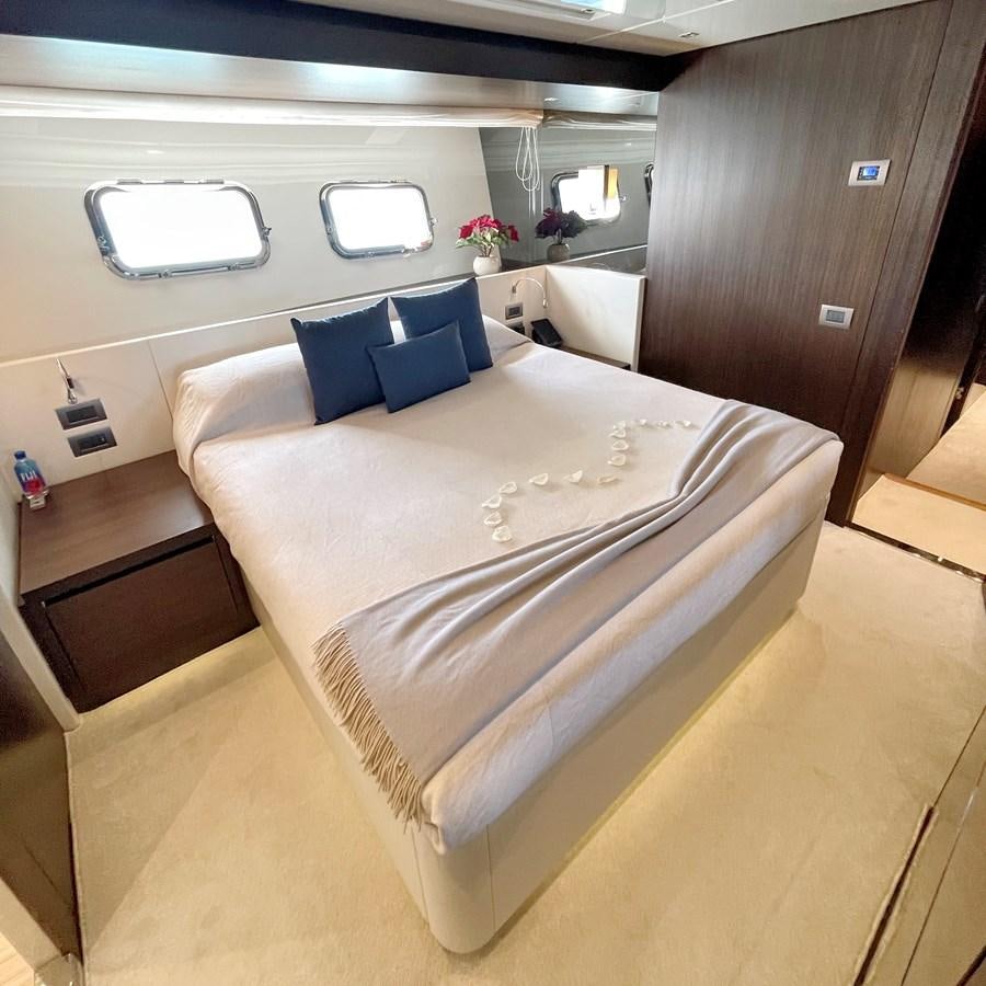 a large white bed in a room aboard C-DAZE Yacht for Sale