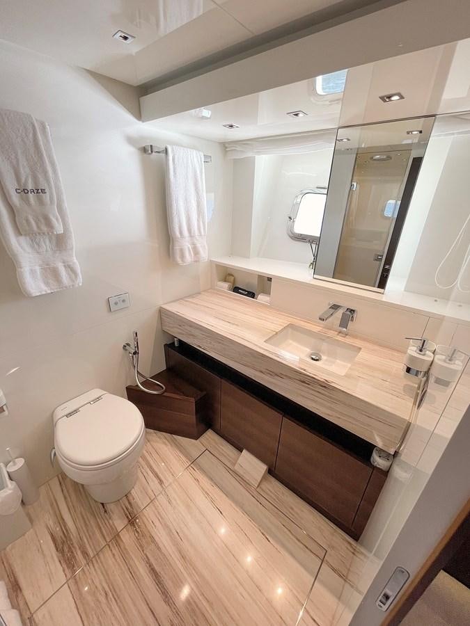 a bathroom with a large mirror aboard C-DAZE Yacht for Sale