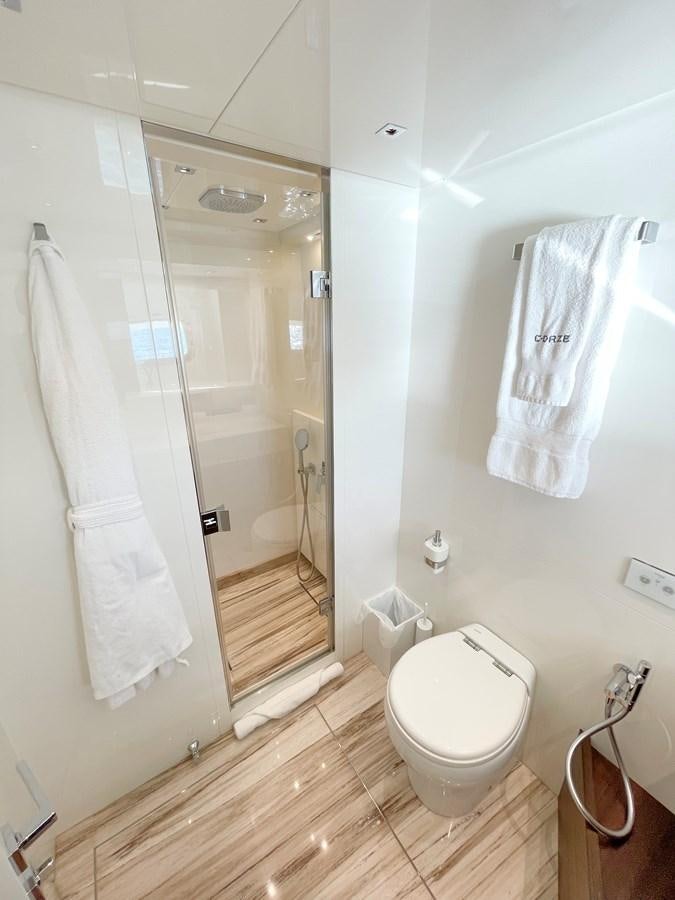 a bathroom with a glass shower aboard C-DAZE Yacht for Sale