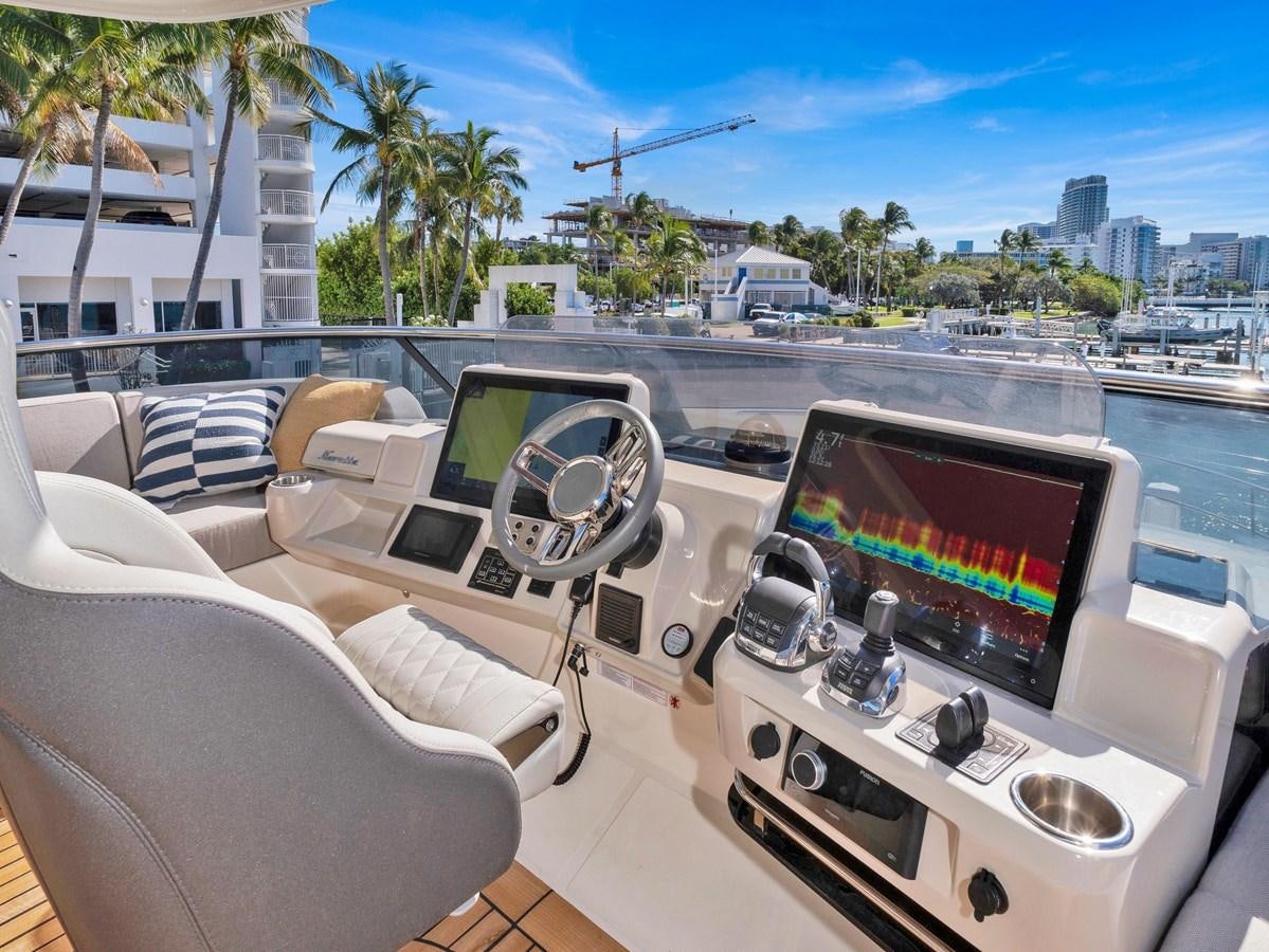 a room with a view of the ocean and a city aboard POWERSFUL Yacht for Sale