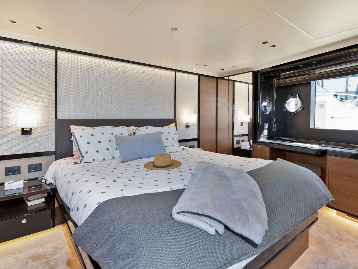 a large bedroom with a large bed aboard POWERSFUL Yacht for Sale