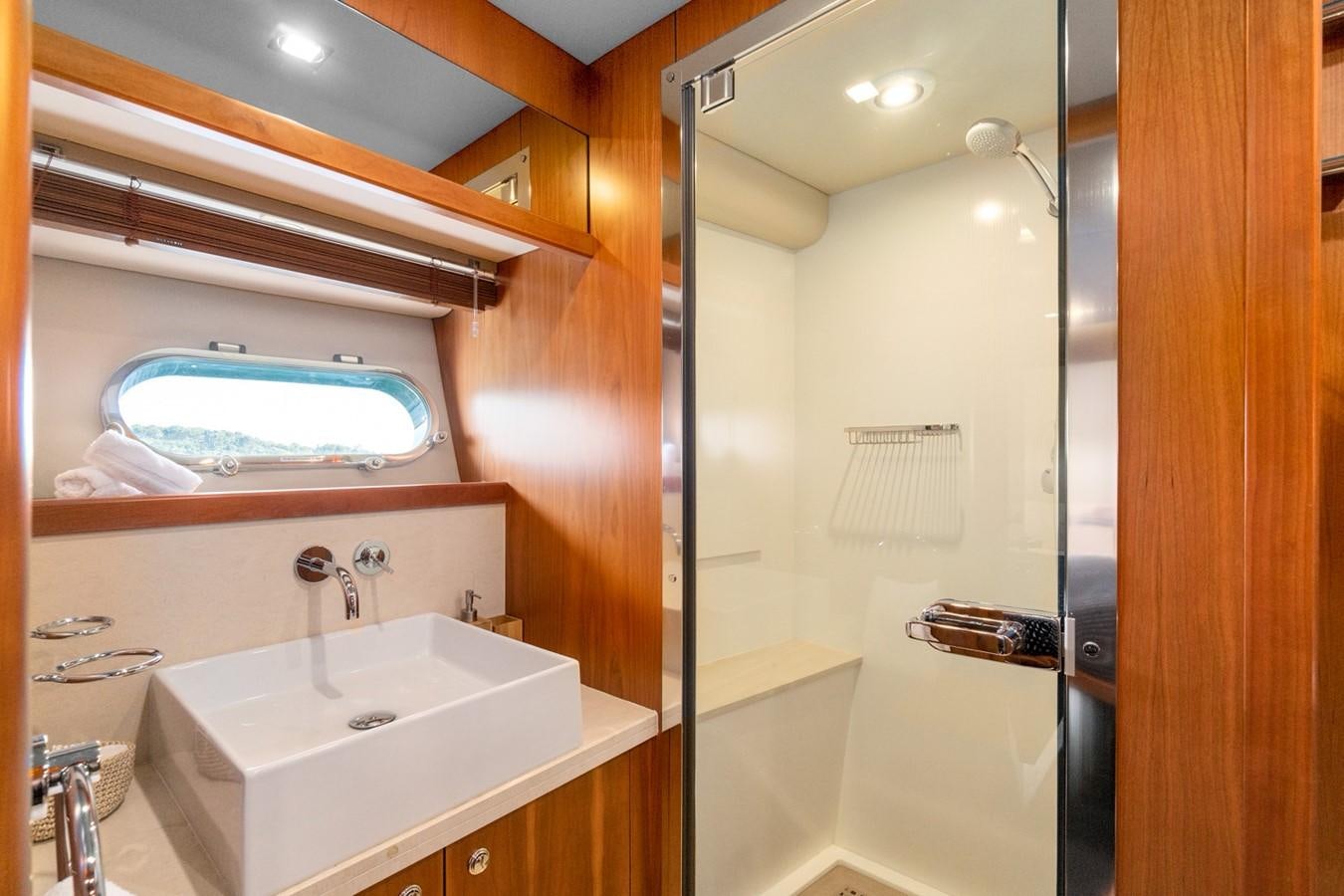 a bathroom with a sink and a mirror aboard EYE Yacht for Sale