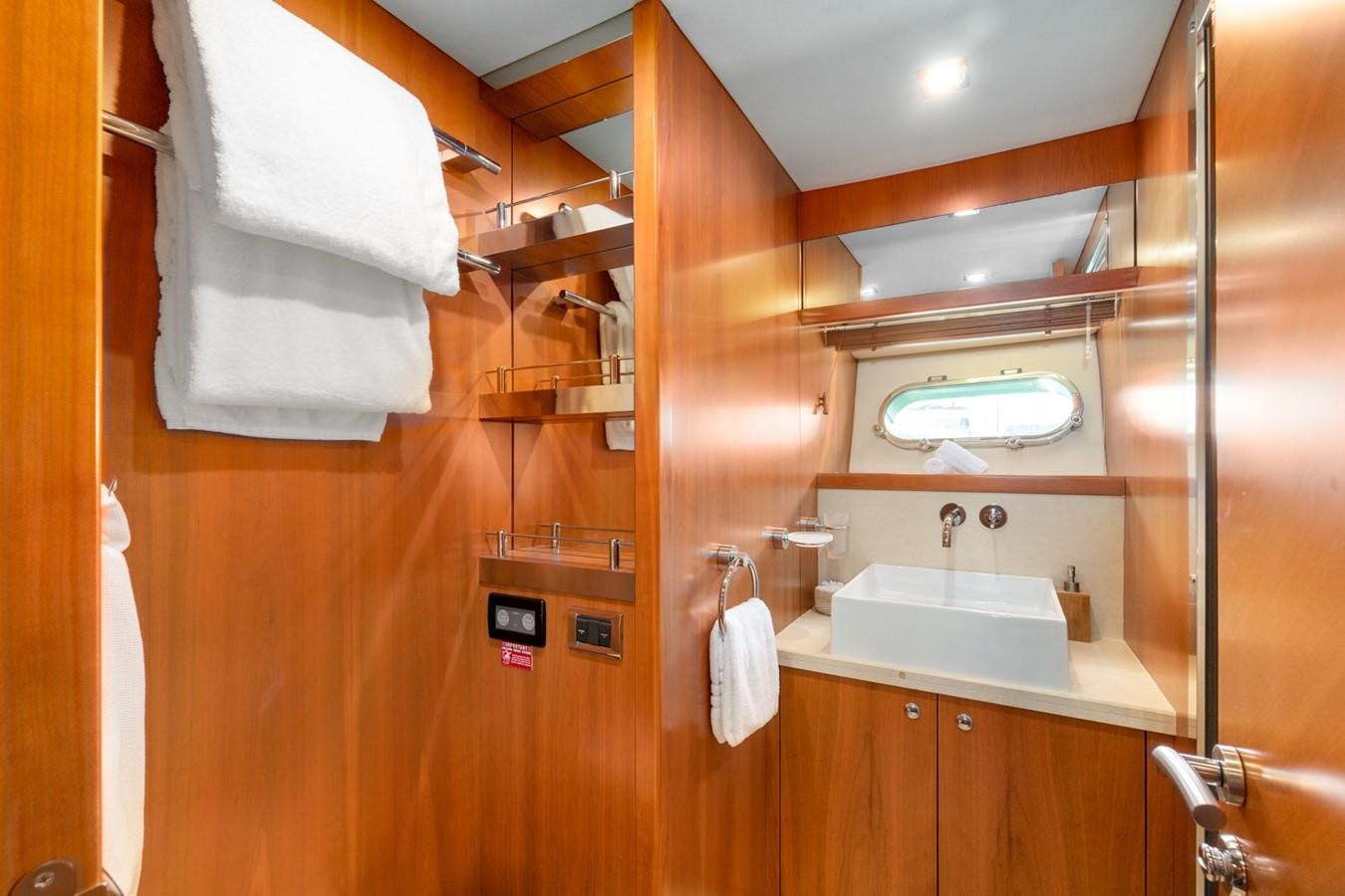 a bathroom with a sink and a mirror aboard EYE Yacht for Sale