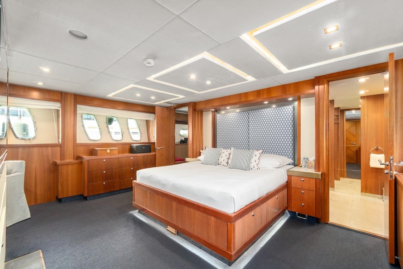 a large bedroom with a large bed aboard EYE Yacht for Sale