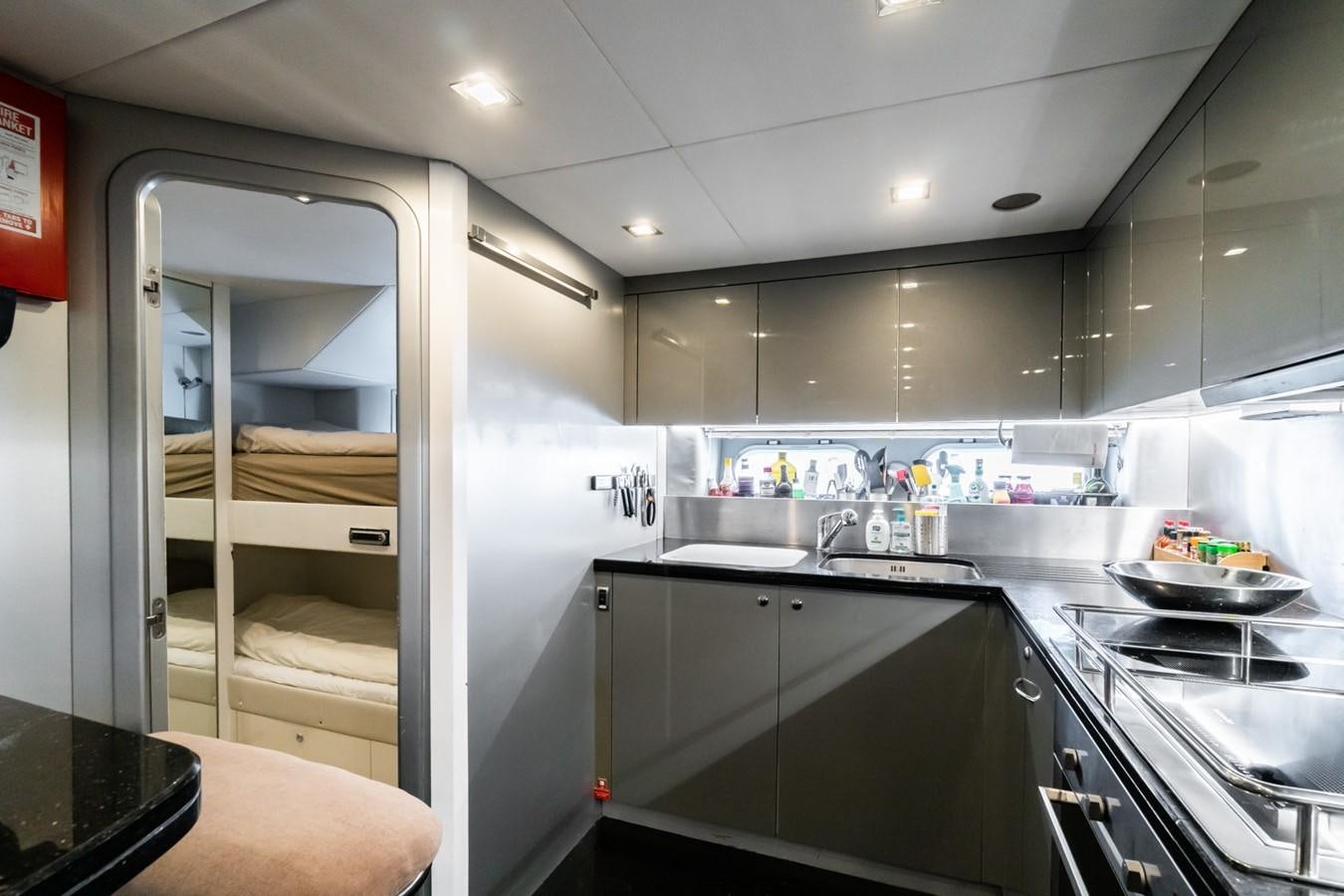 a kitchen with a glass door aboard EYE Yacht for Sale