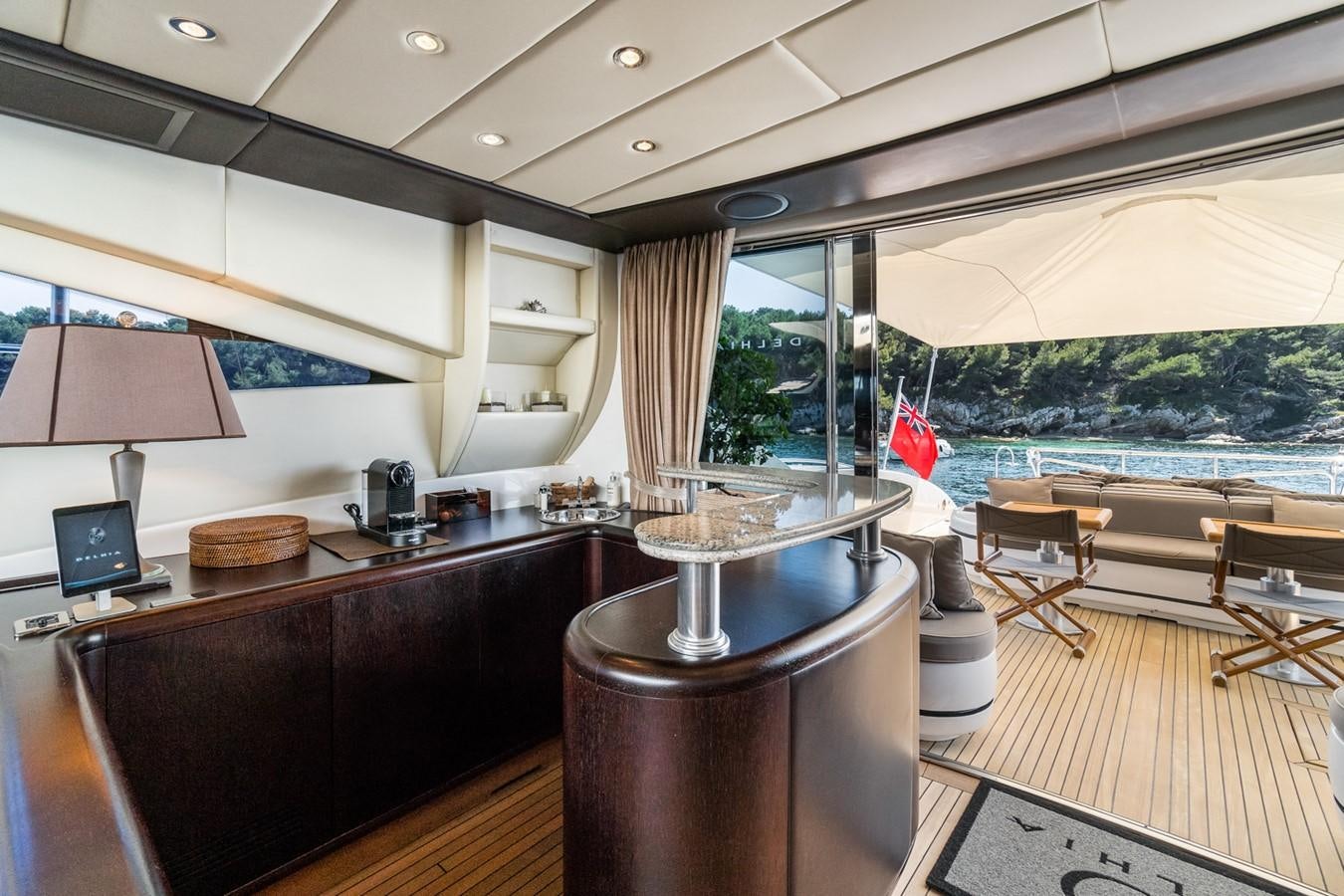 a kitchen with a bar and a bar aboard KUY KUY Yacht for Sale