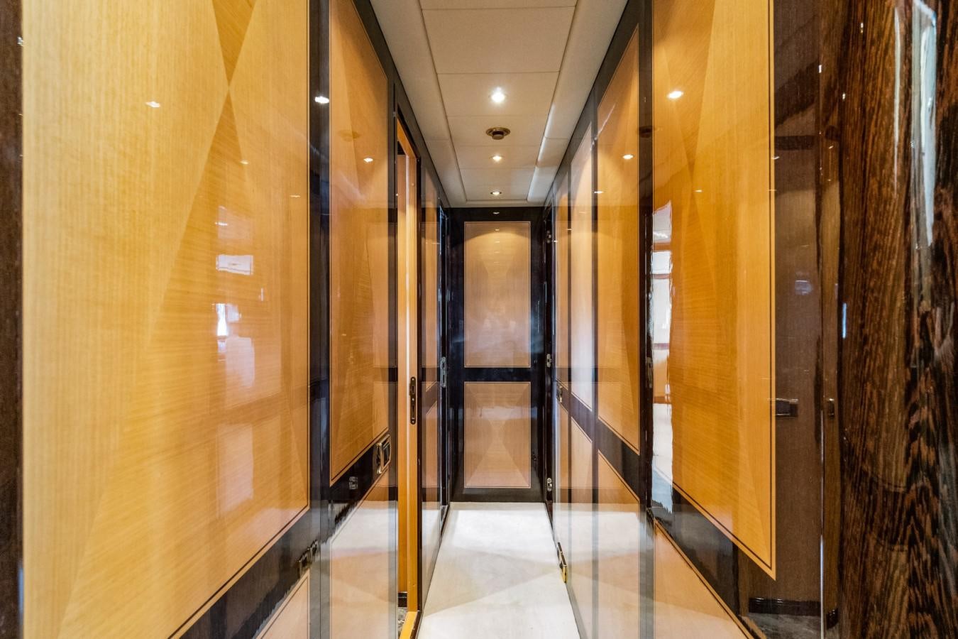 a hallway with doors aboard KUY KUY Yacht for Sale