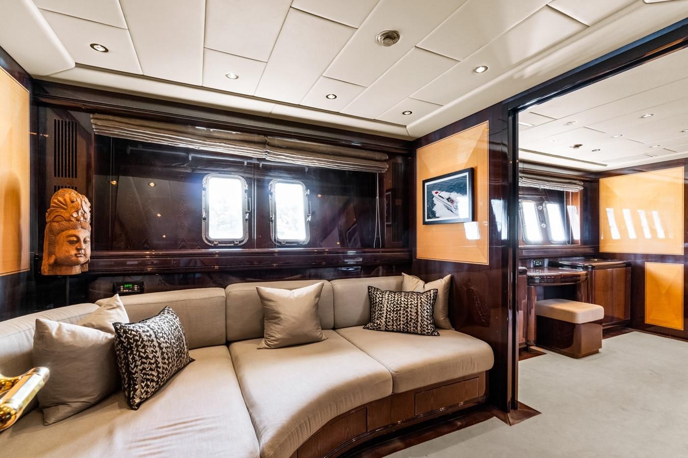 a living room with a large screen aboard KUY KUY Yacht for Sale