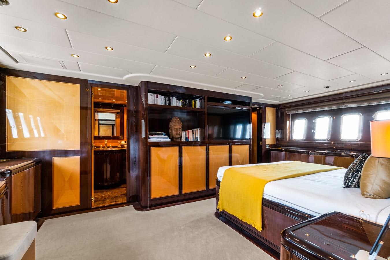 a room with a bed and a book shelf aboard KUY KUY Yacht for Sale
