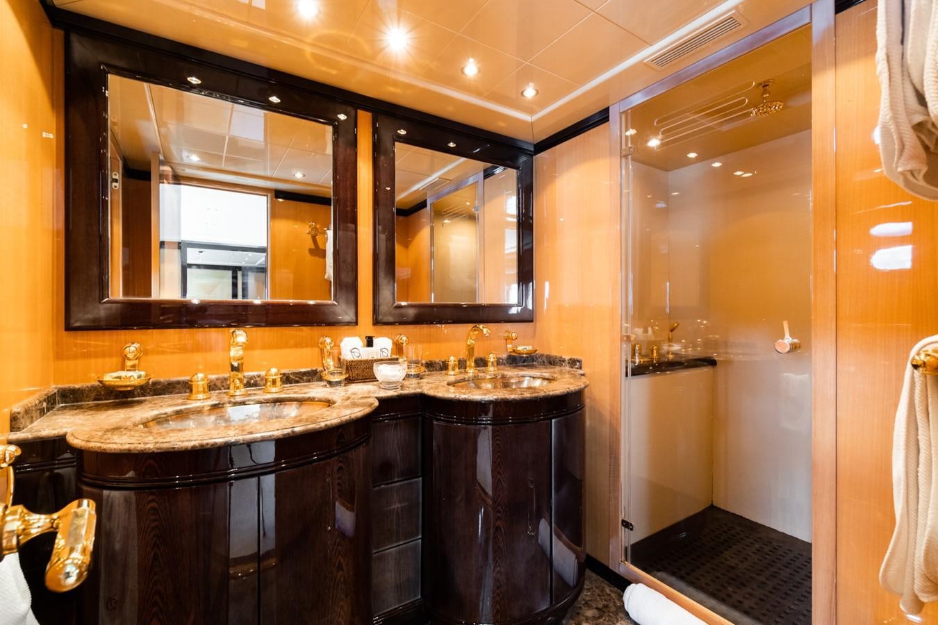 a bathroom with a large mirror aboard KUY KUY Yacht for Sale