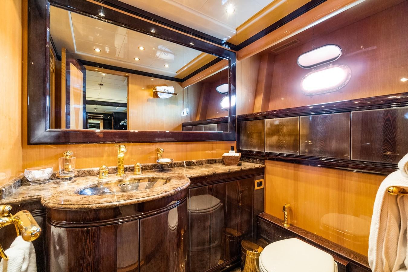 a bathroom with a large mirror aboard KUY KUY Yacht for Sale